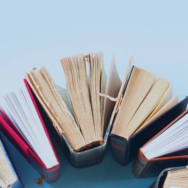 Pile of books representing the education industry