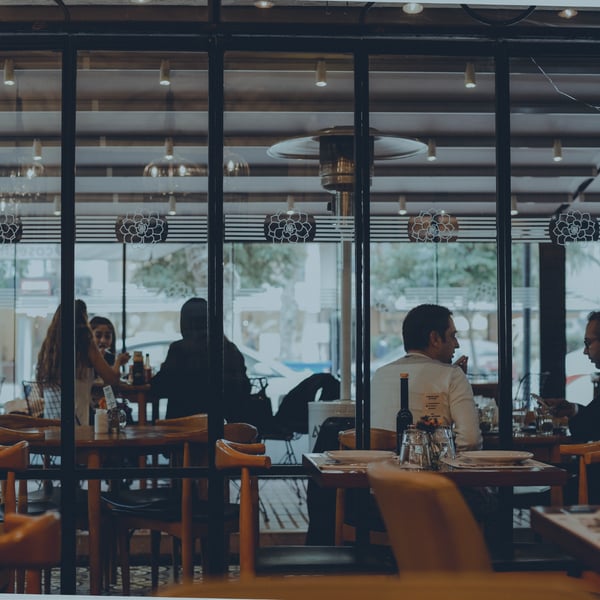 Restaurant interior with people talking representing the restaurant industry